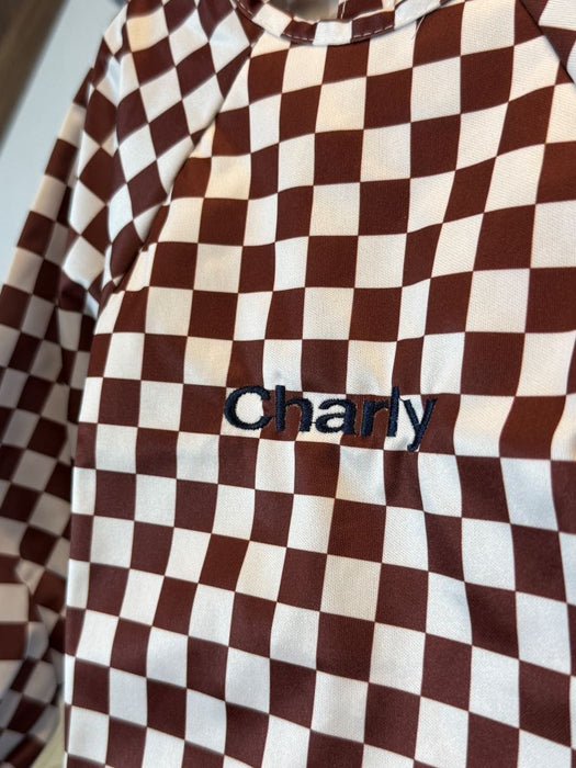 Bavoir imperméable évolutif à manches longues motif damier