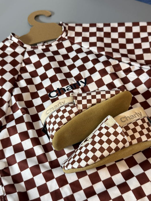 Bavoir imperméable évolutif à manches longues motif damier