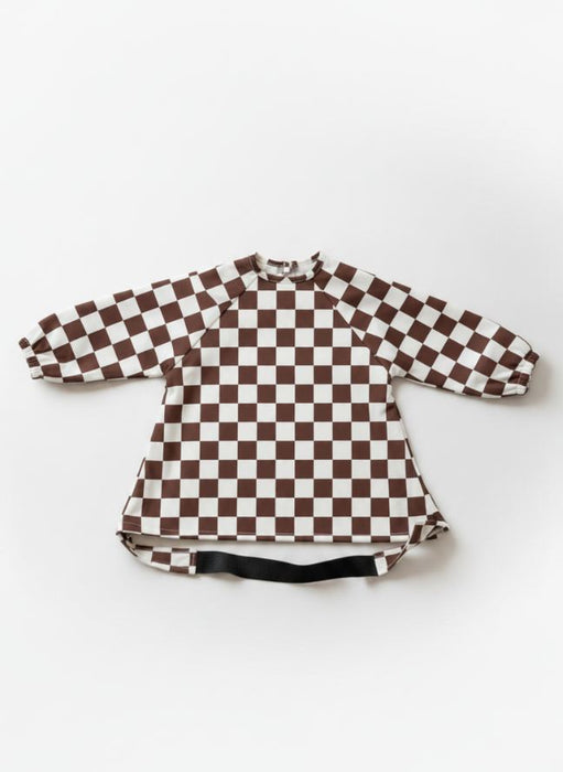 Bavoir imperméable évolutif à manches longues motif damier