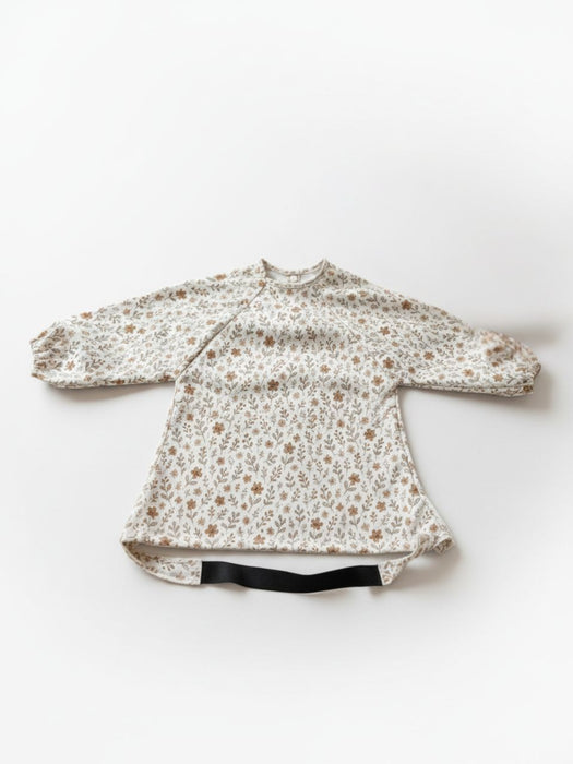 Bavoir imperméable évolutif à manches longues motif damier